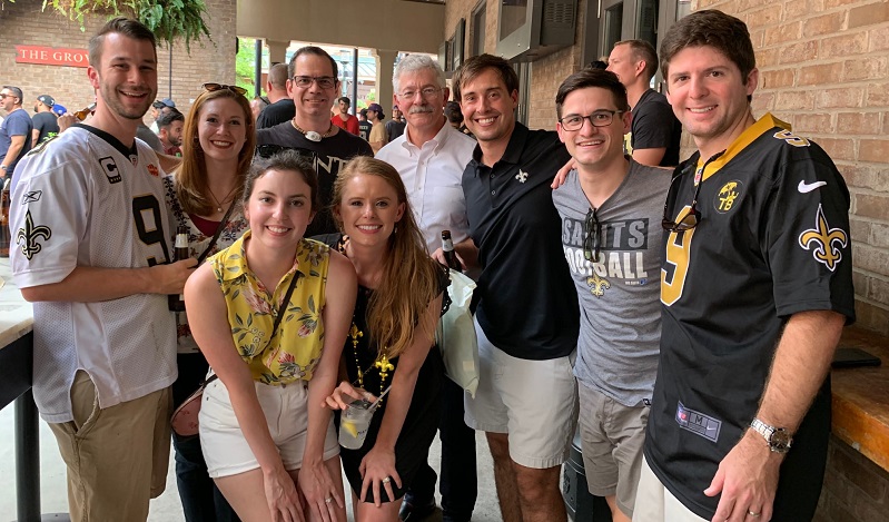 Team members attending a Saints game